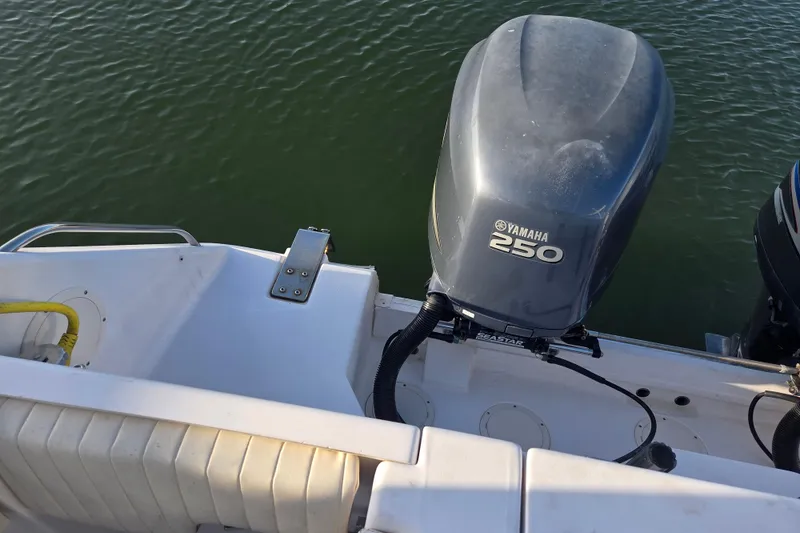 Slide: The Image of 2004 Grady-White Express 330 boat with Yamaha 250 outboard motor on calm water. - 8