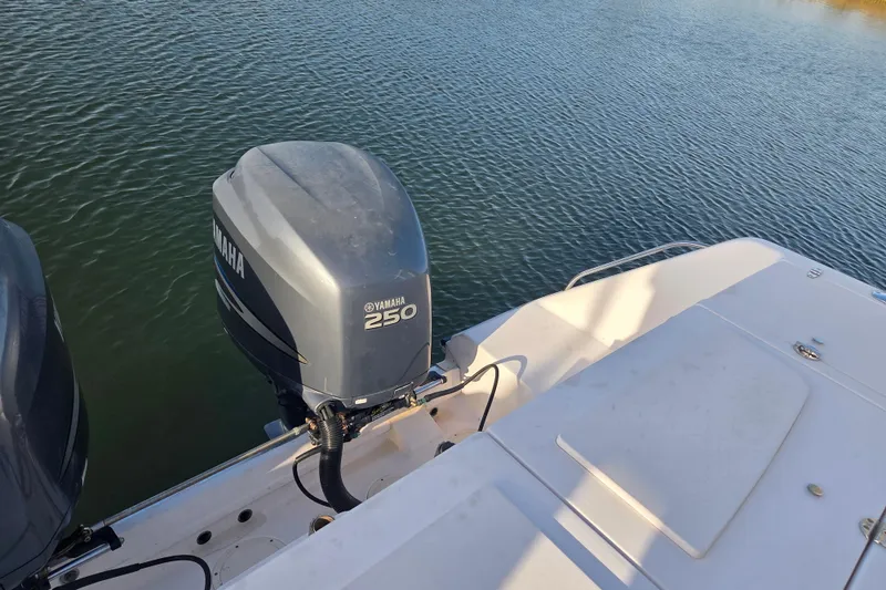 Slide: The Image of 2004 Grady-White Express 330 boat with Yamaha 250 outboard motor on calm water. - 9