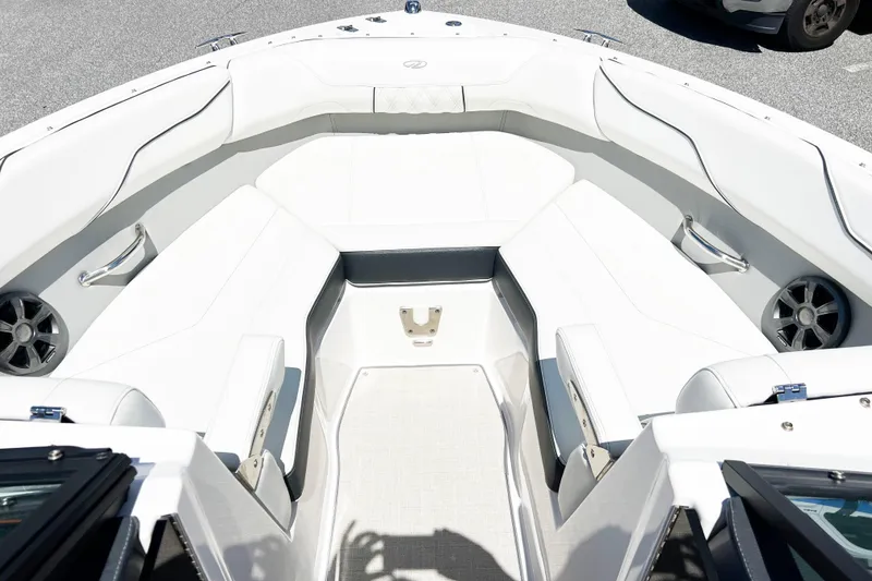 Slide: The Image of 2022 Regal LX2 boat interior with white seating and speakers. - 11