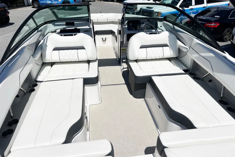Slide: The Image of 2022 Regal LX2 boat interior with luxurious white seating and modern design. - 3