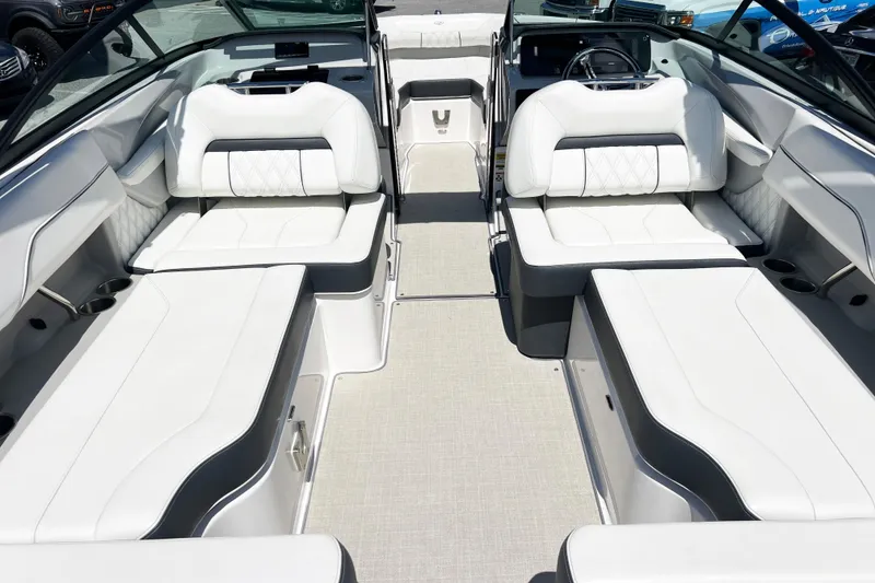 Slide: The Image of 2022 Regal LX2 boat interior with luxurious white seating and modern design. - 4