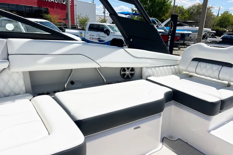 Slide: The Image of Luxurious interior of a 2022 Regal LX2 boat with white seating and modern design. - 6