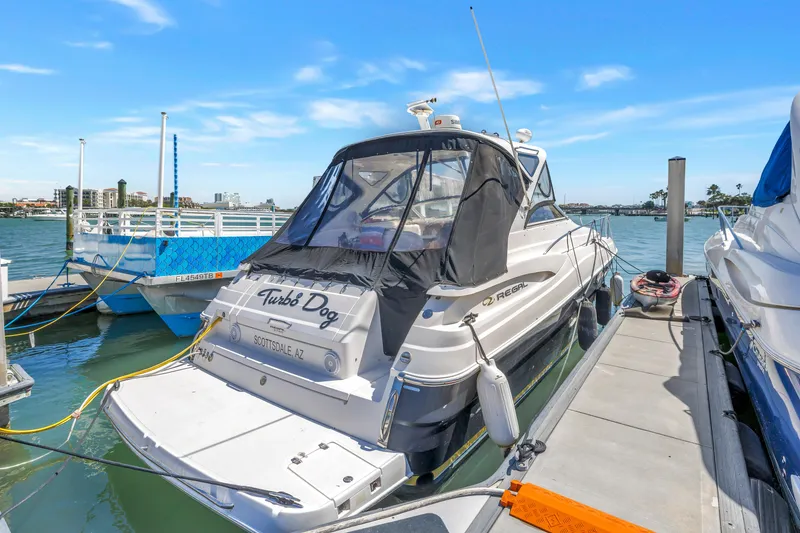 The Image of 2007 Regal Commodore 3760 IB docked at marina, clear blue sky background. - 0
