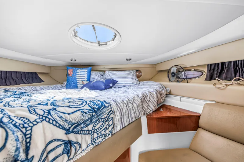 Slide: The Image of Cozy cabin interior of 2007 Regal Commodore 3760 IB yacht with nautical bedding. - 10