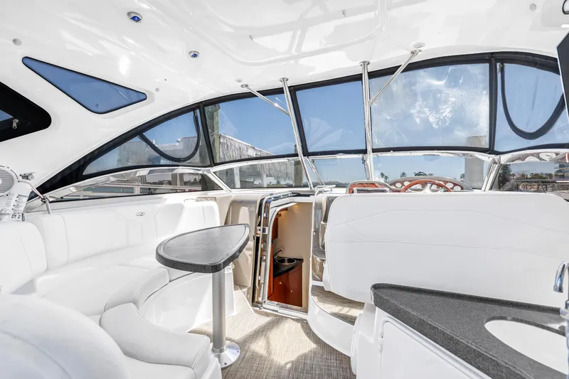 Slide: The Image of Luxurious interior of 2007 Regal Commodore 3760 IB yacht with white seating and sleek design. - 17