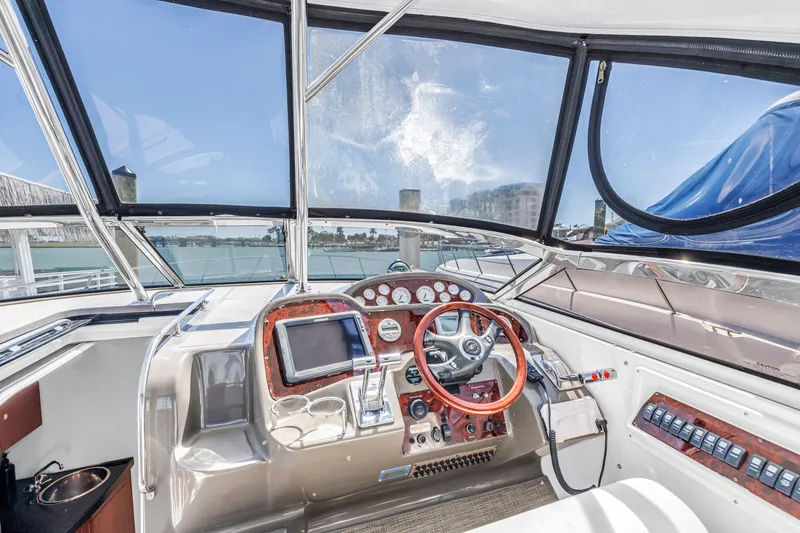 Slide: The Image of 2007 Regal Commodore 3760 IB helm with modern controls and waterfront view. - 20