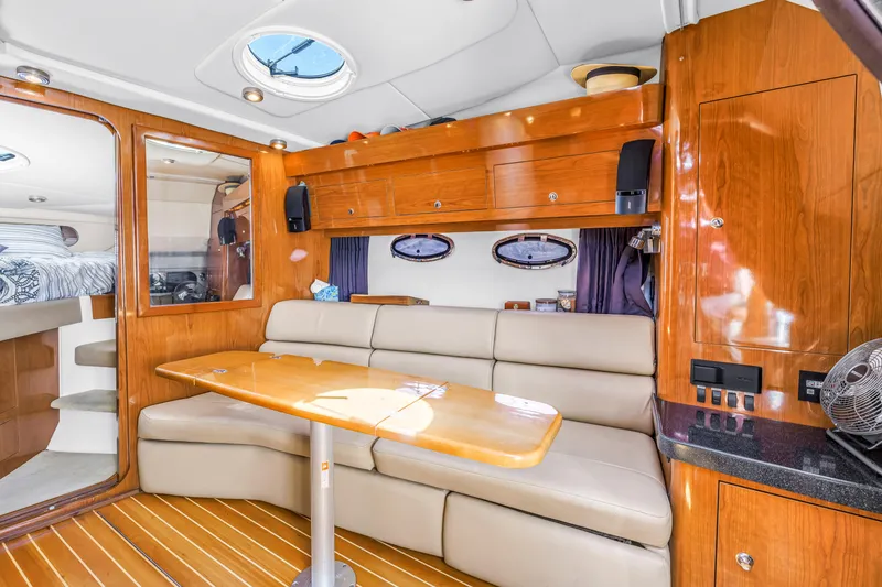 Slide: The Image of Luxurious interior of 2007 Regal Commodore 3760 IB yacht with wood finishes and seating area. - 6