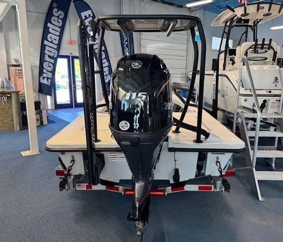 Slide: The Image of 2026 Maverick 18 HPX-V boat in showroom with outboard motor. - 18