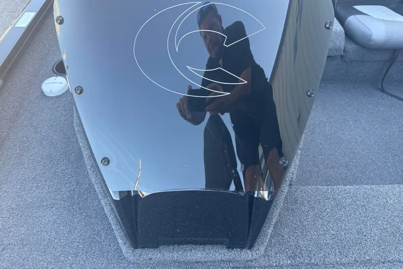 Slide: The Image of 2021 Crestliner XF 179 boat interior with reflective surface and logo. - 15