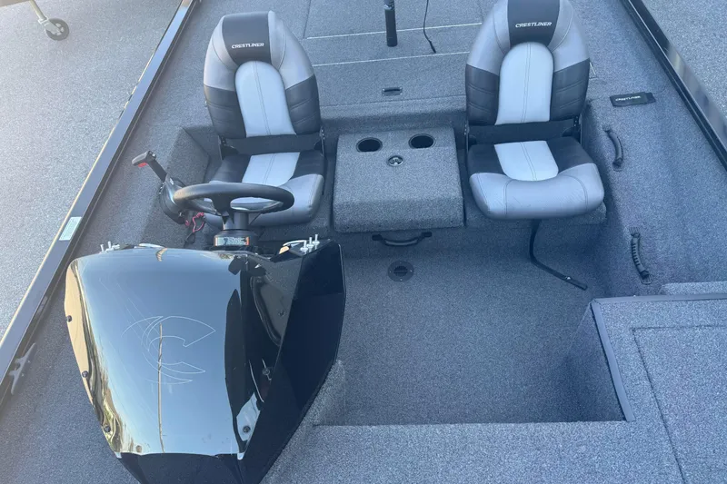 Slide: The Image of 2021 Crestliner XF 179 boat interior with dual seats and steering console. - 16