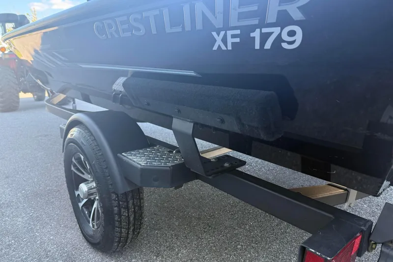 Slide: The Image of 2021 Crestliner XF 179 boat on trailer, showcasing sleek design and durable construction. - 4
