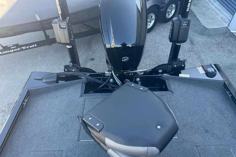 Slide: The Image of 2021 Crestliner XF 179 boat deck with motor and seat, featuring Minn Kota accessories. - 8