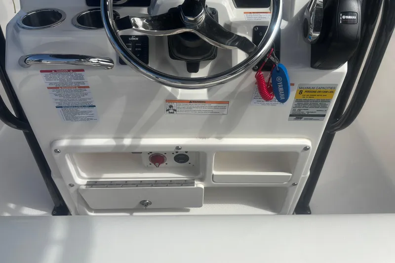 Slide: The Image of 2023 Robalo R200 Center Console dashboard with steering wheel and controls. - 10