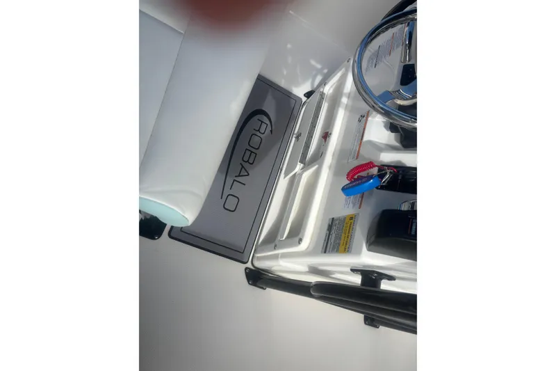 Slide: The Image of 2023 Robalo R200 Center Console boat interior with steering wheel and controls. - 11