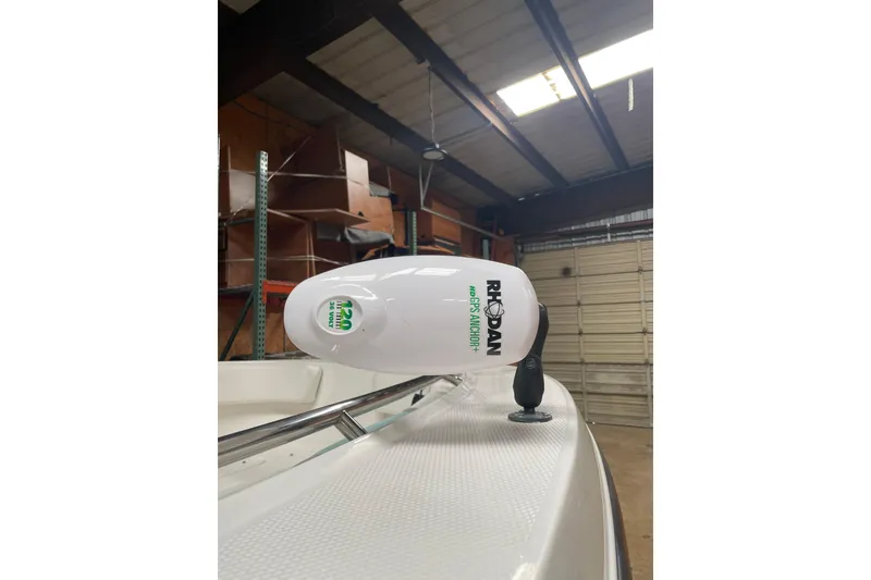 Slide: The Image of 2023 Robalo R200 Center Console with Rhodan GPS Anchor in a garage. - 15
