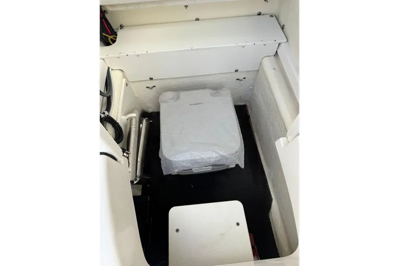 Slide: The Image of 2023 Robalo R200 Center Console boat interior storage compartment. - 16