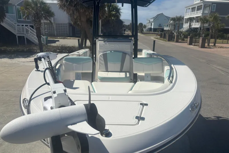 Slide: The Image of 2023 Robalo R200 Center Console boat parked on a sunny street. - 4