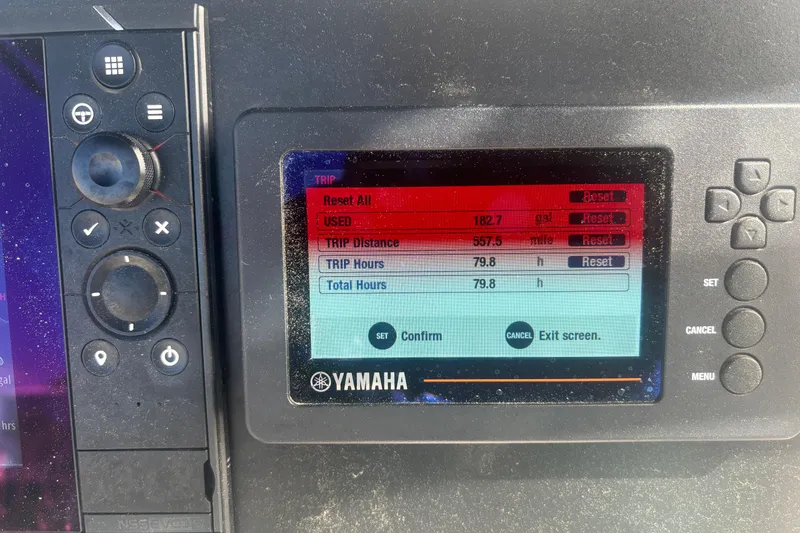 Slide: The Image of Yamaha display on 2023 Robalo R200 Center Console showing trip data and settings. - 8