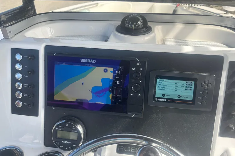Slide: The Image of 2023 Robalo R200 Center Console dashboard with Simrad and Yamaha displays. - 9