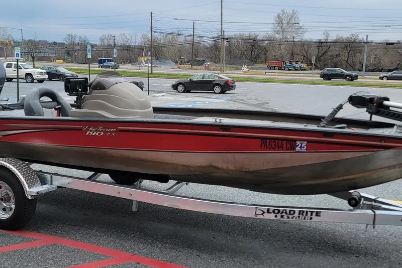 Slide: The Image of 2006 Tracker Pro Team 190 TX boat on Load Rite trailer in parking lot. - 10