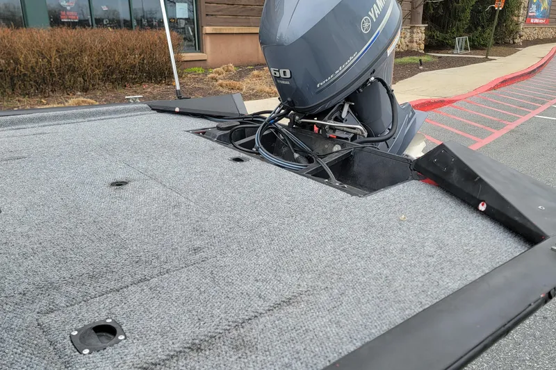 Slide: The Image of 2006 Tracker Pro Team 190 TX boat with Yamaha outboard motor in parking lot. - 5