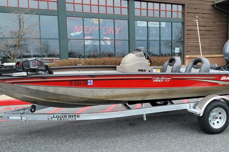 Slide: The Image of 2006 Tracker Pro Team 190 TX boat on Load Rite trailer outside a store. - 8