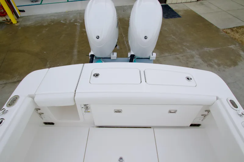 Slide: The Image of 2026 Regulator 23 boat with dual outboard engines, viewed from above. - 19