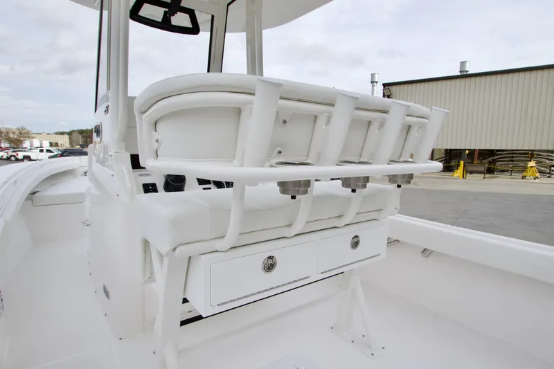Slide: The Image of 2026 Regulator 23 boat interior with rod holders and storage drawers. - 20