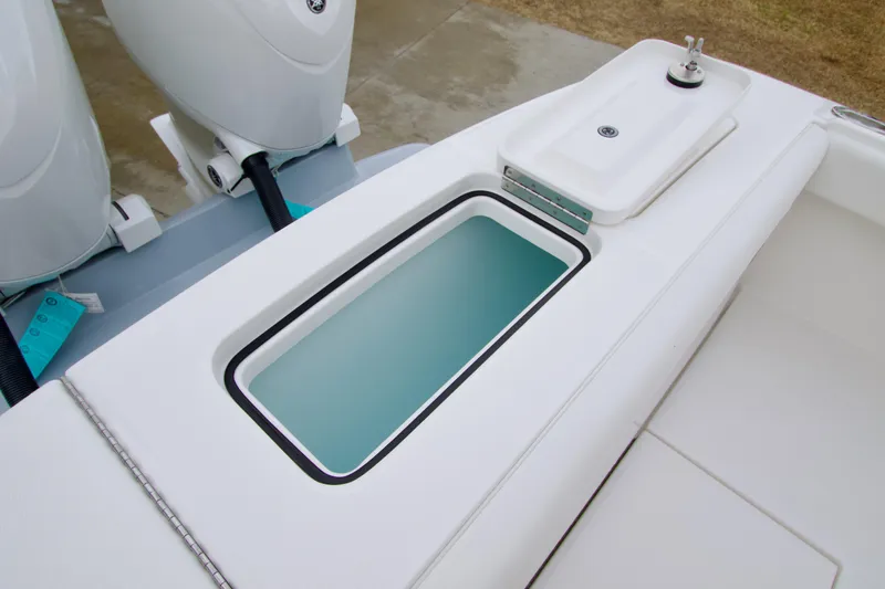 Slide: The Image of 2026 Regulator 23 boat with livewell and dual outboard motors. - 9