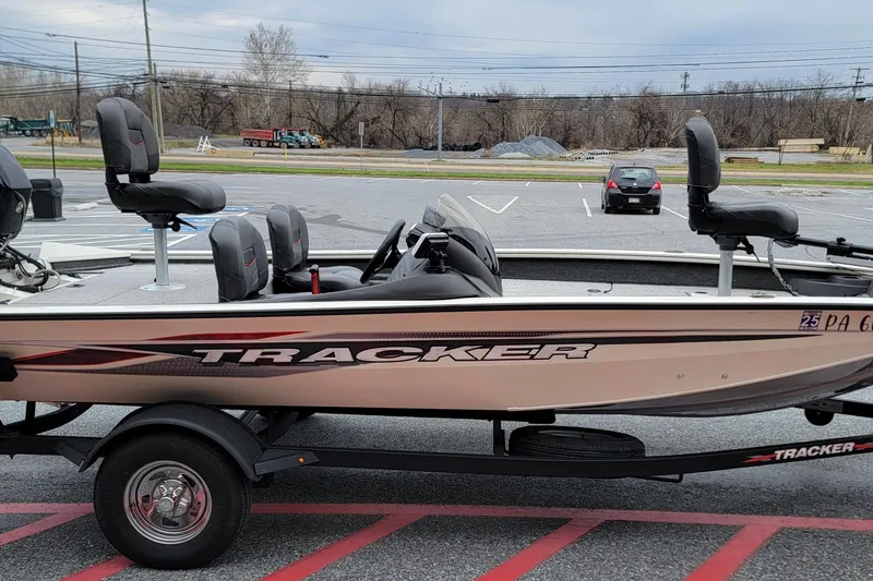 Slide: The Image of 2024 Tracker Pro Team 175 TF fishing boat on trailer in parking lot. - 9