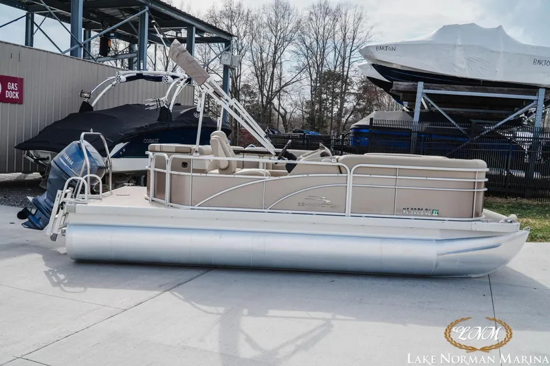 The Image of 2013 Bennington 20 SL pontoon boat at Lake Norman Marina, parked near gas dock. - 1