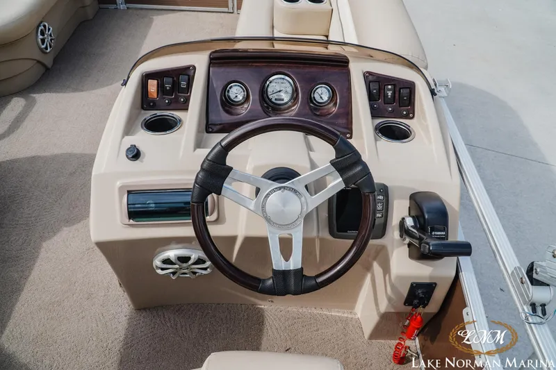 Slide: The Image of Steering console of a 2013 Bennington 20 SL pontoon boat with gauges and controls. - 10