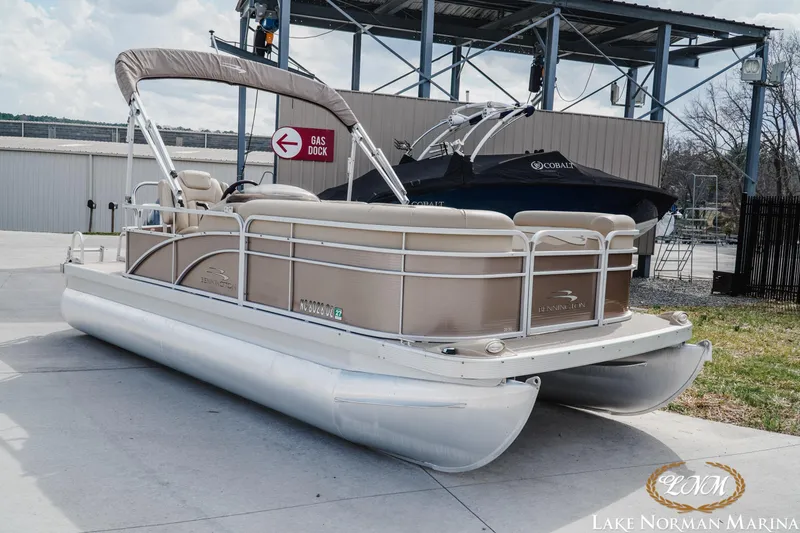 Slide: The Image of 2013 Bennington 20 SL pontoon boat at Lake Norman Marina, near gas dock. - 3