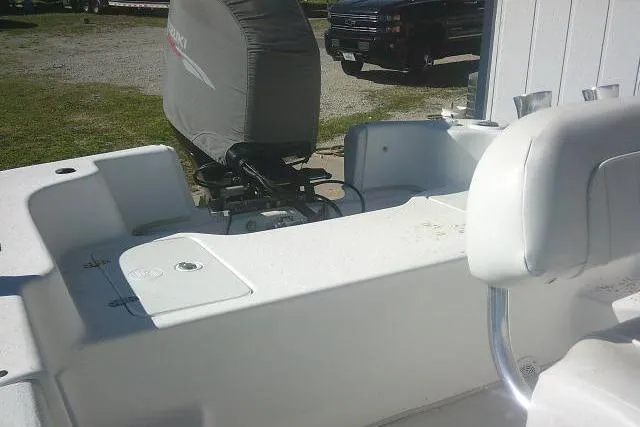 Slide: The Image of 2011 Carolina Skiff 258 DLV boat interior with covered motor and seating. - 26