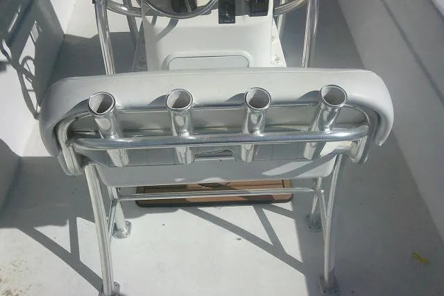 Slide: The Image of 2011 Carolina Skiff 258 DLV boat with rod holders and steering console. - 29