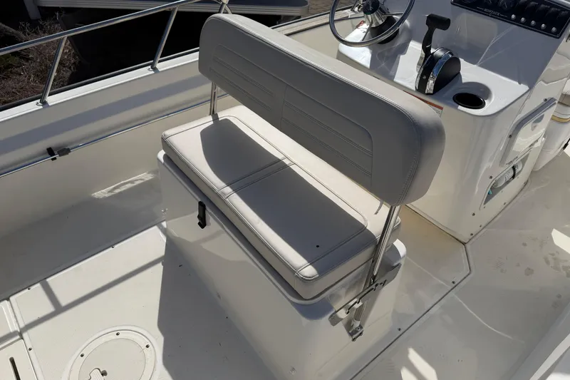 Slide: The Image of 2020 Boston Whaler 170 Montauk boat interior with helm seat and steering console. - 10