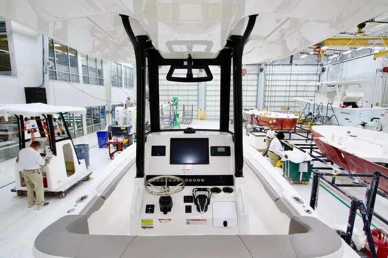 Slide: The Image of 2026 Regulator 23 boat interior in a manufacturing facility. - 13