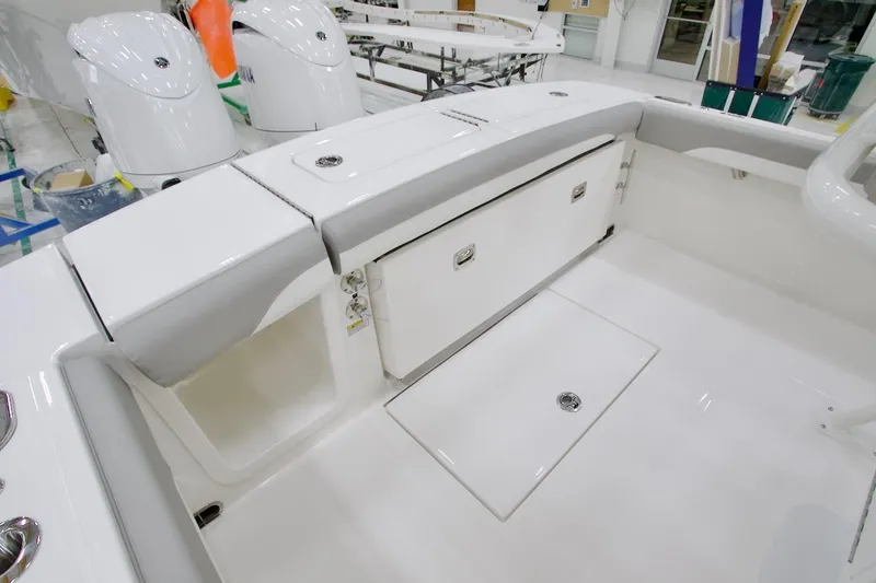 Slide: The Image of 2026 Regulator 23 boat interior with storage compartments and sleek design. - 17