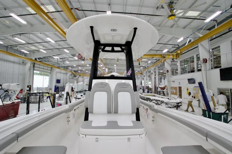 Slide: The Image of 2026 Regulator 23 boat interior in a modern manufacturing facility. - 29