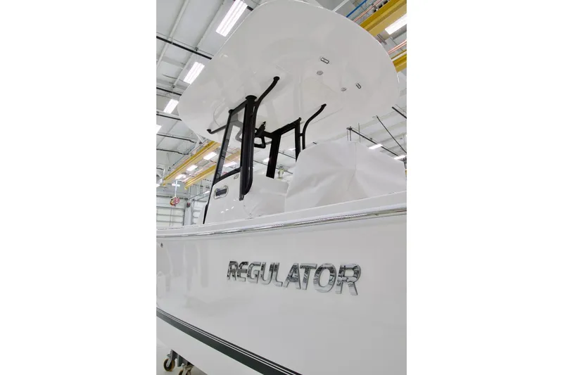 Slide: The Image of 2026 Regulator 23 boat in a modern indoor facility. - 4