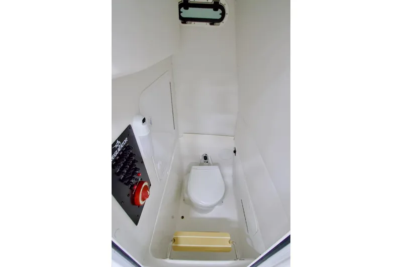 Slide: The Image of 2026 Regulator 23 boat interior with compact marine toilet and control panel. - 9