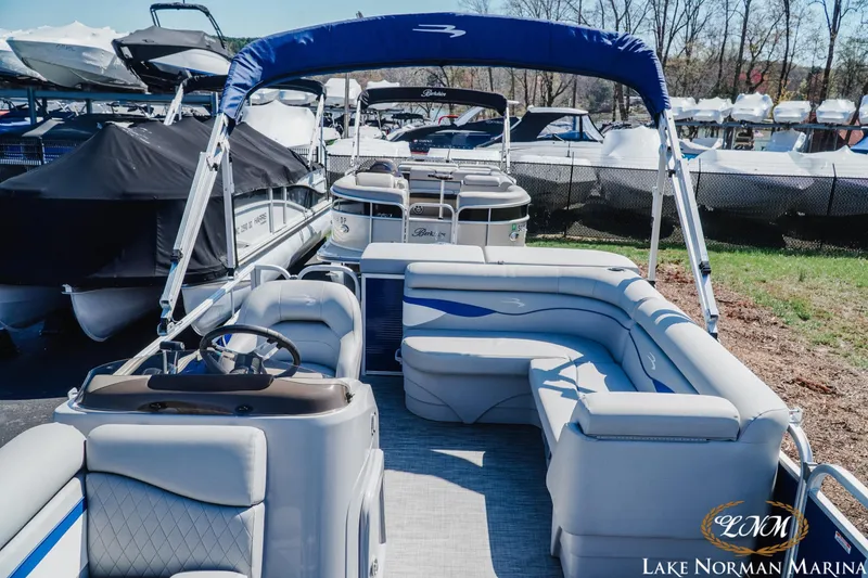 Slide: The Image of 2021 Bennington 188 SVL pontoon boat with blue canopy at Lake Norman Marina. - 10