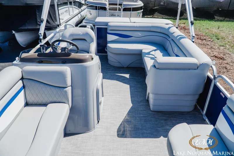 Slide: The Image of 2021 Bennington 188 SVL pontoon boat interior with plush seating at Lake Norman Marina. - 11
