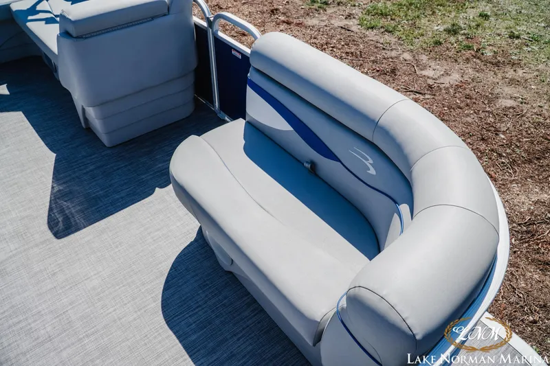Slide: The Image of 2021 Bennington 188 SVL pontoon boat seating with gray upholstery and blue accents. - 13