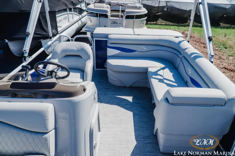 Slide: The Image of 2021 Bennington 188 SVL pontoon boat interior with plush seating at Lake Norman Marina. - 14