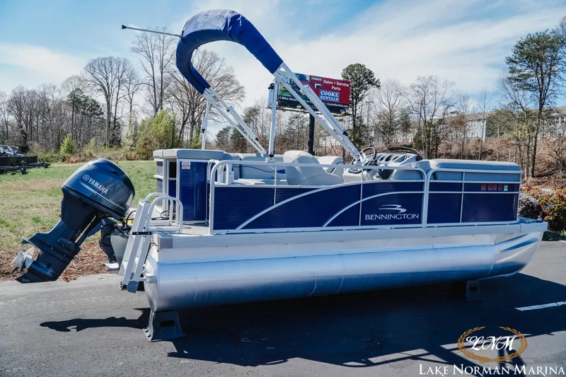 Slide: The Image of 2021 Bennington 188 SVL pontoon boat with Yamaha motor at Lake Norman Marina. - 2