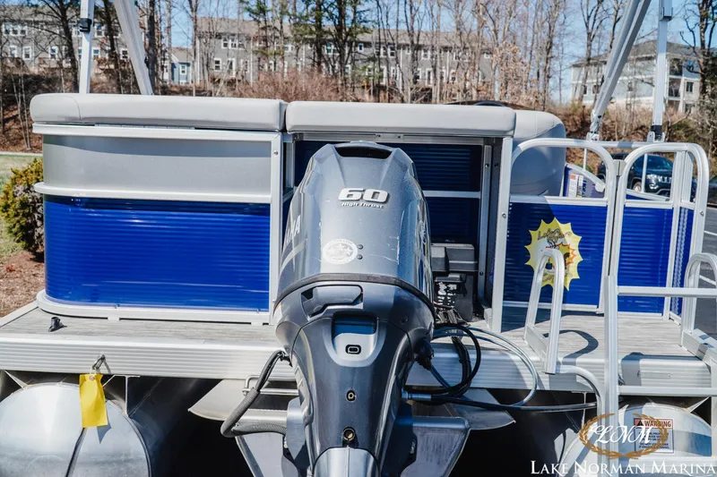 Slide: The Image of 2021 Bennington 188 SVL pontoon boat with Yamaha 60 horsepower engine at marina. - 4