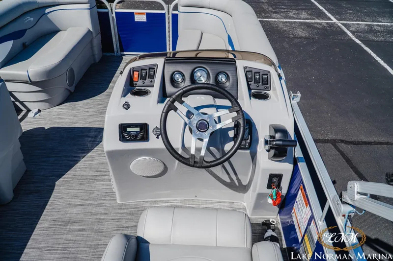Slide: The Image of 2021 Bennington 188 SVL boat interior with steering wheel and control panel. - 7