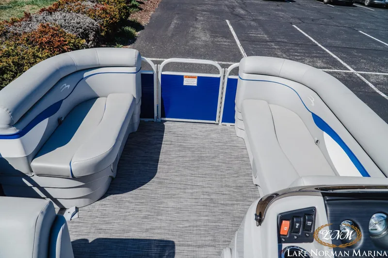 Slide: The Image of 2021 Bennington 188 SVL pontoon boat interior with plush seating at Lake Norman Marina. - 8