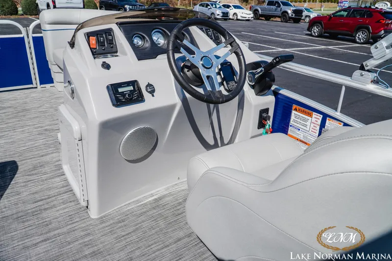 Slide: The Image of 2021 Bennington 188 SVL boat interior with steering wheel and control panel at Lake Norman Marina. - 9